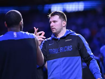 Dec 25, 2024; Dallas, Texas, USA; Dallas Mavericks guard Kyrie Irving (11) greets guard Luka Doncic (77) before the game against the Minnesota Timberwolves at the American Airlines Center. Mandatory Credit: Jerome Miron-Imagn Images