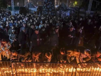 People light candles for the victims of the yesterday's shooting rampage in Cetinje, in Podogrica, Montenegro, Thursday, Jan. 2, 2025. (AP Photo/Risto Bozovic)