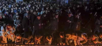 People light candles for the victims of the yesterday's shooting rampage in Cetinje, in Podogrica, Montenegro, Thursday, Jan. 2, 2025. (AP Photo/Risto Bozovic)