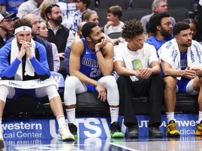 Jan 3, 2025; Dallas, Texas, USA; Dallas Mavericks guard Klay Thompson (31) and Dallas Mavericks guard Spencer Dinwiddie (26) react on the bench during the fourth quarter against the Cleveland Cavaliers at American Airlines Center. Mandatory Credit: Kevin Jairaj-Imagn Images