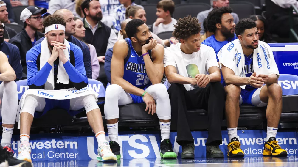 Jan 3, 2025; Dallas, Texas, USA; Dallas Mavericks guard Klay Thompson (31) and Dallas Mavericks guard Spencer Dinwiddie (26) react on the bench during the fourth quarter against the Cleveland Cavaliers at American Airlines Center. Mandatory Credit: Kevin Jairaj-Imagn Images