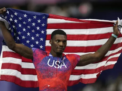 FILE - Fred Kerley, of the United States, poses after winning the bronze medal in the men's 100 meters final at the 2024 Summer Olympics, Sunday, Aug. 4, 2024, in Saint-Denis, France. (AP Photo/Ashley Landis, File)