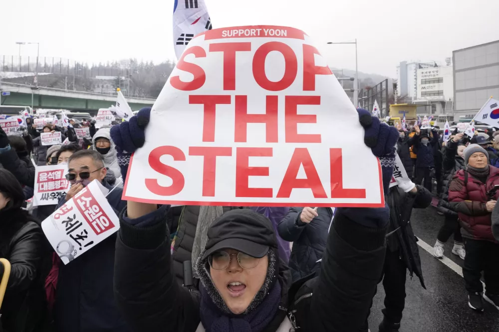 A supporter of impeached South Korean President Yoon Suk Yeol shouts slogans during a rally to oppose his impeachment near the presidential residence in Seoul, South Korea, Sunday, Jan. 5, 2025. (AP Photo/Ahn Young-joon)