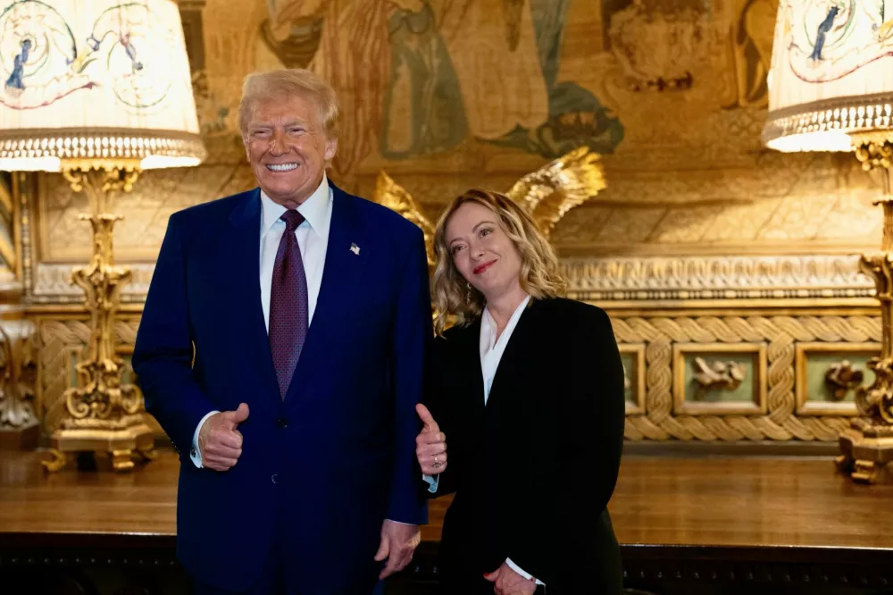 U.S. President-elect Donald Trump meets with Italian Prime Minister Giorgia Meloni at Mar-a-Lago in Palm Beach, Florida, U.S. January 4, 2025. Italian Government/Handout via REUTERS THIS IMAGE HAS BEEN SUPPLIED BY A THIRD PARTY. NO RESALES. NO ARCHIVES. MANDATORY CREDIT.