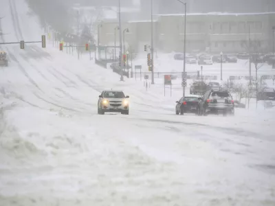 A blizzard hits, warranting a no-travel advisory in much of the region, on Wednesday, Feb. 22, 2023, in Sioux Falls, S.D. Brutal winter weather is hammering the northern U.S. with "whiteout" snow, dangerous wind gusts and bitter cold. (Erin Woodiel /The Argus Leader via AP)