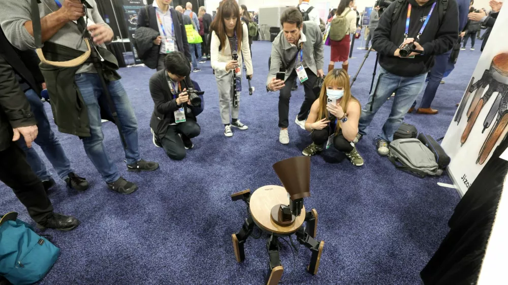 People look at the Mi-Mo AI robot during CES Unveiled at CES 2025, an annual consumer electronics trade show, in Las Vegas, Nevada, U.S. January 5, 2025. REUTERS/Steve Marcus