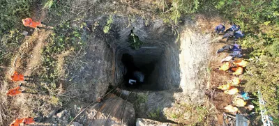 This image provided by Indian Army shows rescue workers standing around a coal mine where at least nine workers are trapped, in Umrangso area of Dimapur Hasao district in northeastern state of Assam, India, Tuesday, Jan. 7, 2025. (Indian Army via AP)