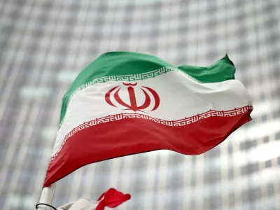 FILE PHOTO: Iranian flag flies in front of the UN office building, housing IAEA headquarters, amid the coronavirus disease (COVID-19) pandemic, in Vienna, Austria, May 24, 2021. REUTERS/Lisi Niesner//File Photo