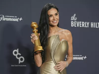 Demi Moore poses in the press room with the award for best performance by a female actor in a motion picture - musical or comedy for "The Substance" during the 82nd Golden Globes on Sunday, Jan. 5, 2025, at the Beverly Hilton in Beverly Hills, Calif. (AP Photo/Chris Pizzello)