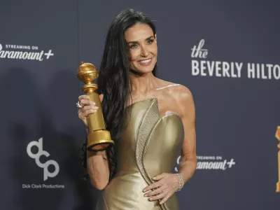 Demi Moore poses in the press room with the award for best performance by a female actor in a motion picture - musical or comedy for "The Substance" during the 82nd Golden Globes on Sunday, Jan. 5, 2025, at the Beverly Hilton in Beverly Hills, Calif. (AP Photo/Chris Pizzello)