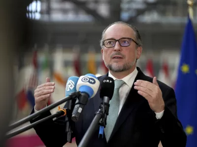 FILE -Austria's Foreign Minister Alexander Schallenberg speaks with the media as he arrives for a meeting of EU foreign ministers at the European Council building in Brussels, Dec. 16, 2024. (AP Photo/Virginia Mayo, File)