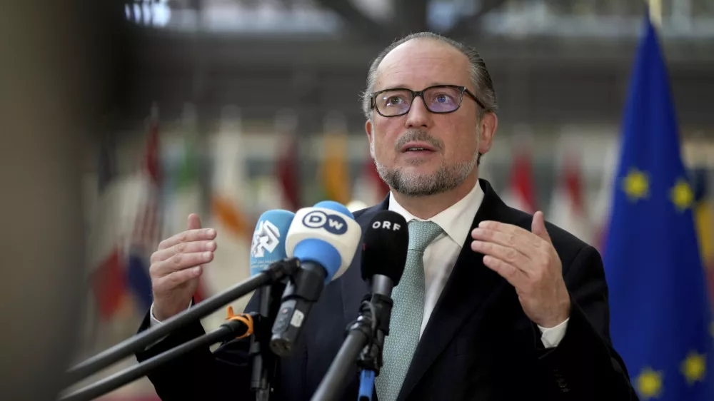 FILE -Austria's Foreign Minister Alexander Schallenberg speaks with the media as he arrives for a meeting of EU foreign ministers at the European Council building in Brussels, Dec. 16, 2024. (AP Photo/Virginia Mayo, File)