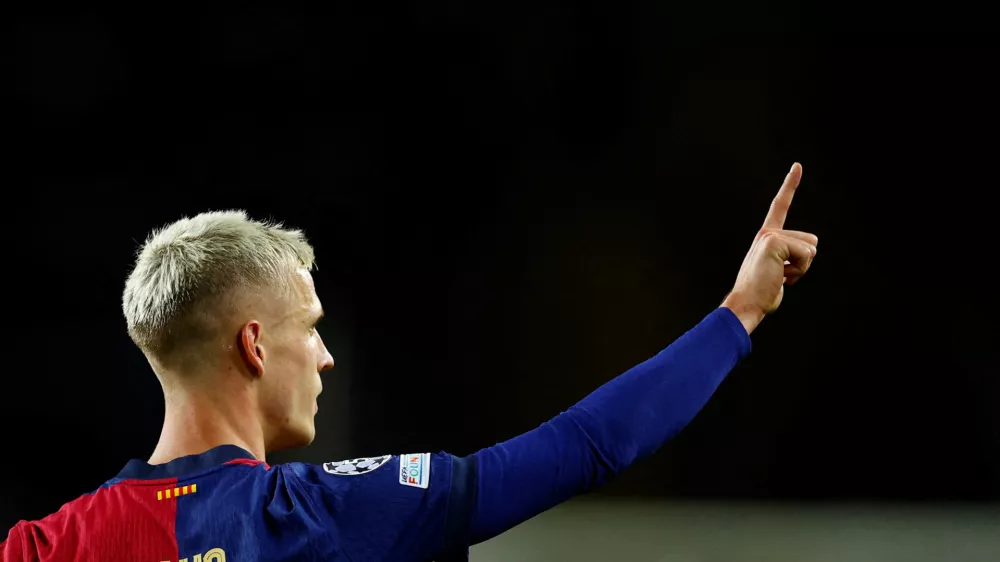 FILE PHOTO: Soccer Football - Champions League - FC Barcelona v Brest - Estadi Olimpic Lluis Companys, Barcelona, Spain - November 26, 2024 FC Barcelona's Dani Olmo celebrates scoring their second goal REUTERS/Albert Gea/File Photo