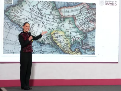 Mexico's President Claudia Sheinbaum shows a 1661 world map showing the Americas and the Gulf of Mexico in response to U.S. President-elect Donald Trump's comments about renaming the body of water, during a press conference at National Palace in Mexico City, Mexico, in this photo distributed on January 8, 2025. Presidencia de Mexico/Handout via REUTERS ATTENTION EDITORS - THIS IMAGE HAS BEEN SUPPLIED BY A THIRD PARTY. NO RESALES. NO ARCHIVES.