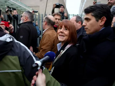 19 December 2024, France, Avignon: Gisele Pelicot (C) arrives with her lawyer Stephane Babonneau (R) at the courthouse in Avignon, where the verdict is expected in the trial against her ex-husband and 50 other defendants accused of drugging her and orchestrating several rapes over almost a decade. Photo: Clement Mahoudeau/AFP/dpa