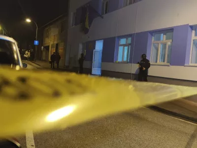 Bosnian police officer guard the local police station after a teenager broke and killed one officer with a knife and wounded another, in the town of Bosanska Krupa, 200 kilometers (120 miles) northwest of Bosnia's capital Sarajevo, Thursday, Oct. 24, 2024. (AP Photo/Edvin Zulic)