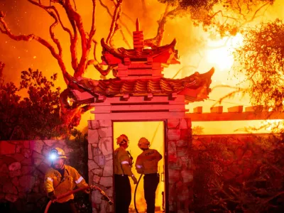 Firefighters battle the Palisades Fire as it burns during a windstorm on the west side of Los Angeles, California, U.S. January 8, 2025. REUTERS/Ringo Chiu      SEARCH "CALIFORNIA WILDFIRES" FOR THIS STORY. SEARCH "WIDER IMAGE" FOR ALL STORIES.      TPX IMAGES OF THE DAY