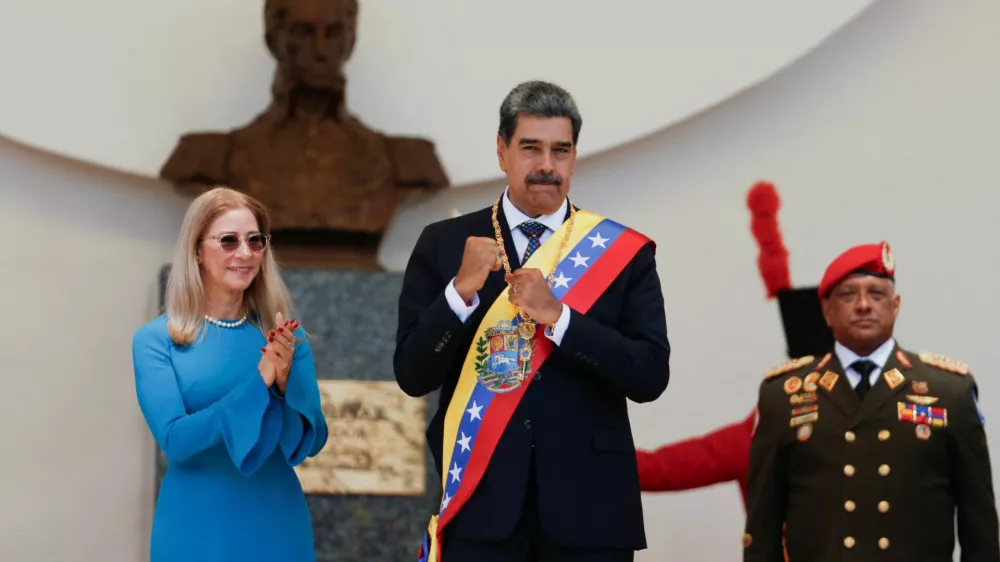 President Nicolas Maduro and his wife Cilia Flores react on the day of his inauguration for a third six-year term in Caracas, Venezuela January 10, 2025. REUTERS/Leonardo Fernandez Viloria