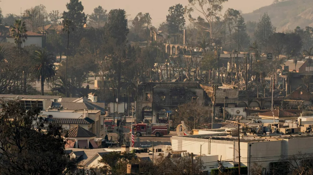 Fire engines drive on Sunset Boulevard during the Palisades Fire in the Pacific Palisades neighborhood, in Los Angeles, California, U.S. January 10, 2025. REUTERS/David Ryder