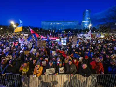 10 January 2025, Slovakia, Bratislava: People hold banners and flags during the "Slovakia is Europe" protest in Bratislava's Freedom Square. Photo: Jaroslav Novák/TASR/dpa