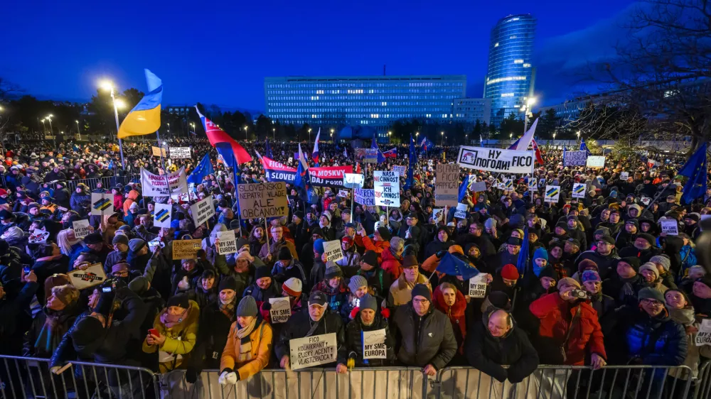 10 January 2025, Slovakia, Bratislava: People hold banners and flags during the "Slovakia is Europe" protest in Bratislava's Freedom Square. Photo: Jaroslav Novák/TASR/dpa