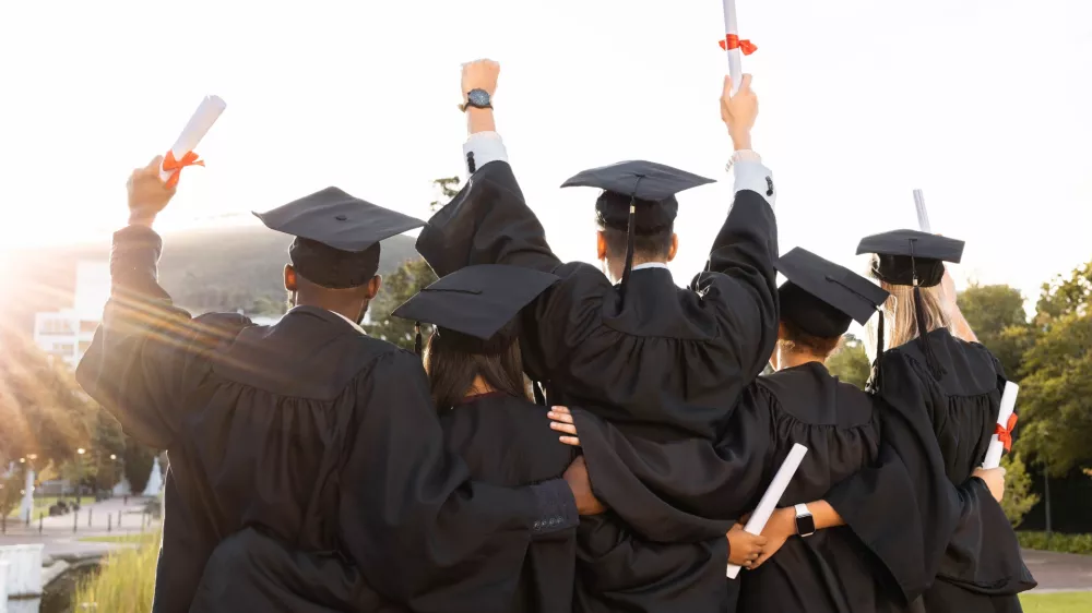 Graduation, group and back view of students celebrate education success. Behind of excited graduates at campus celebration for study goals, university award and learning motivation for happy future