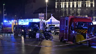 Police officers block the access to the station after two trams collided, injuring dozens of people, though none critically, firefighters said, Saturday, Jan. 11, 2025 in Strasbourg, eastern France. (AP Photo/Pascal Bastien)