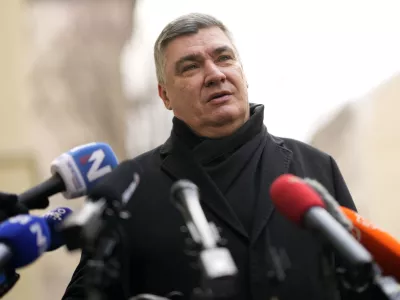 President incumbent Zoran Milanovic talks to media after casting his ballot during a runoff vote for the Croatian presidential election at a polling station in Zagreb, Croatia, Sunday, Jan. 12, 2025. (AP Photo/Darko Bandic)