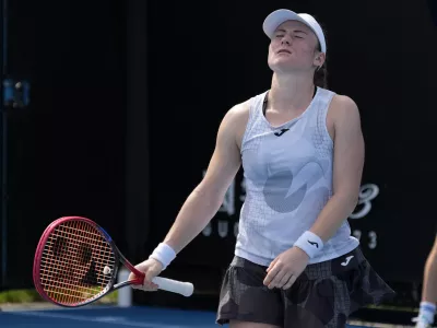 Tamara Zidansek of Slovenia reacts during her first round match against Anastasia Potapova of Russia at the Australian Open tennis championship in Melbourne, Australia, Monday, Jan. 13, 2025. (AP Photo/Manish Swarup)