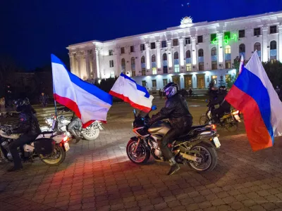 ﻿Motorcyclists have Russian flags attached to their bikes as they arrive on Lenin Square before the announcement of preliminary results of today's referendum on Lenin Square in the Crimean capital of Simferopol, March 16, 2014. Crimeans voted in a referendum on Sunday on whether to break away from Ukraine and join Russia, with Kiev accusing Moscow of pouring forces into the peninsula and warning separatist leaders "the ground will burn under their feet". REUTERS/Thomas Peter (UKRAINE - Tags: POLITICS CIVIL UNREST)