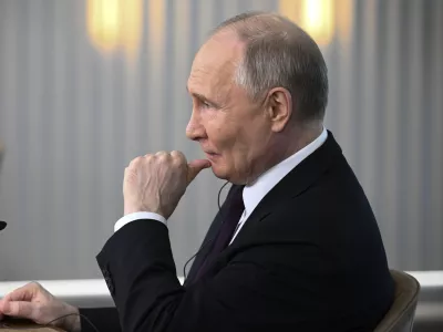 Russian President Vladimir Putin listens to a journalist's question as he meets with senior news leaders of international news agencies on the sidelines of the St. Petersburg International Economic Forum at the Lakhta Center skyscraper, the headquarters of Russian gas monopoly Gazprom in St. Petersburg, Russia, on Wednesday, June 5, 2024. (Vladimir Astapkovich, Sputnik, Kremlin Pool Photo via AP)