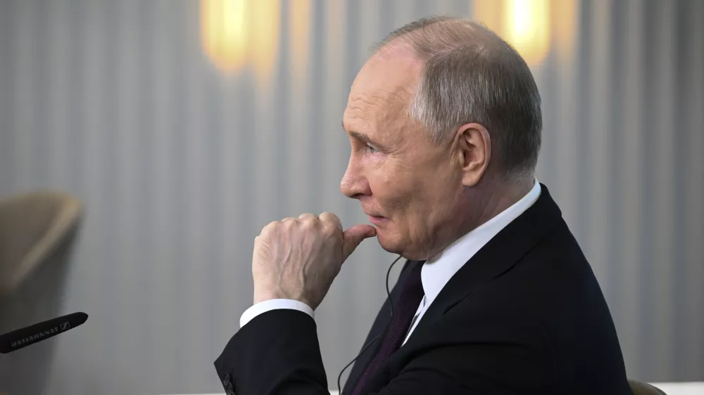 Russian President Vladimir Putin listens to a journalist's question as he meets with senior news leaders of international news agencies on the sidelines of the St. Petersburg International Economic Forum at the Lakhta Center skyscraper, the headquarters of Russian gas monopoly Gazprom in St. Petersburg, Russia, on Wednesday, June 5, 2024. (Vladimir Astapkovich, Sputnik, Kremlin Pool Photo via AP)