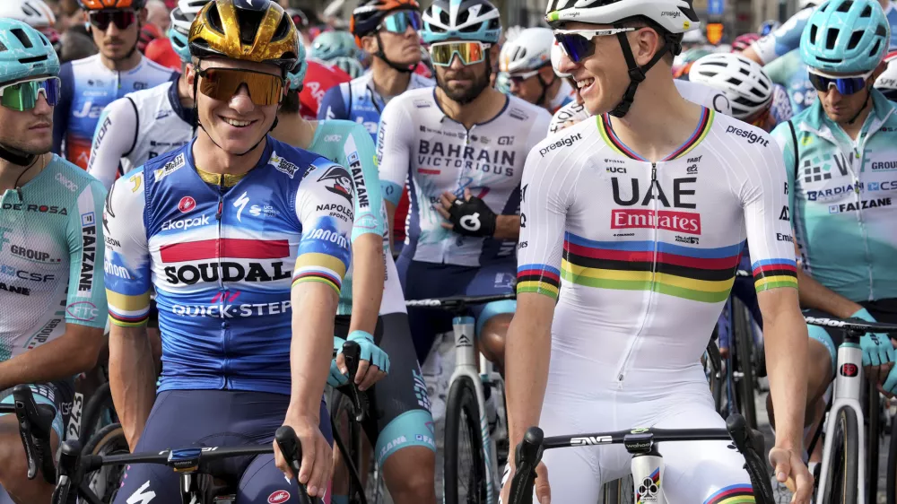 Belgium's Remco Evenepoel, left, and Slovenia's Tadej Pogacar prepare to start the Il Lombardia cycling race in Bergamo, Italy, Saturday, Oct. 12, 2024. (Gian Mattia D'Alberto/LaPresse via AP)