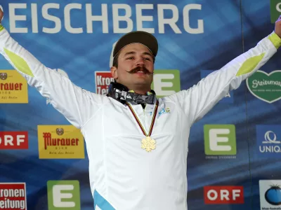 ﻿Slovenia's Filip Flisar celebrates his gold medal at the men's freestyle ski cross event at the Freestyle Ski and Snowboard World Championships in Kreischberg, Austria, Sunday, Jan. 25, 2015. (AP Photo/Darko Bandic)