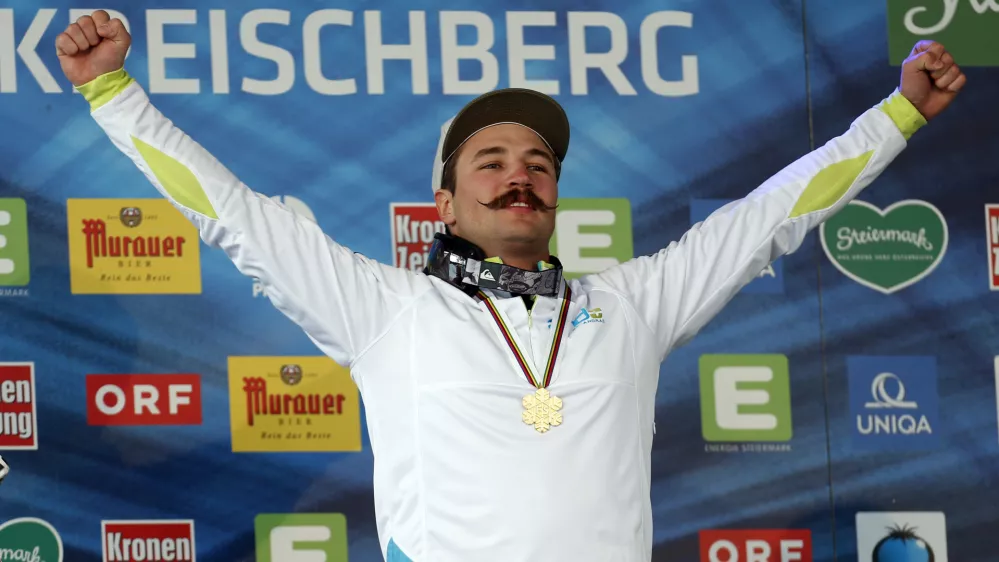 ﻿Slovenia's Filip Flisar celebrates his gold medal at the men's freestyle ski cross event at the Freestyle Ski and Snowboard World Championships in Kreischberg, Austria, Sunday, Jan. 25, 2015. (AP Photo/Darko Bandic)