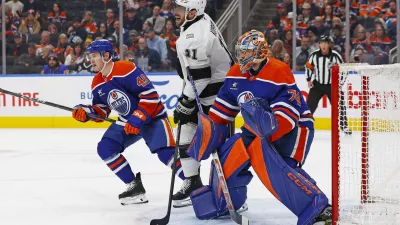 Jan 13, 2025; Edmonton, Alberta, CAN; Los Angeles Kings forward Anze Kopitar (11) looks for a loose puck in front of Edmonton Oilers goaltender Stuart Skinner (74) during the second period at Rogers Place. Mandatory Credit: Perry Nelson-Imagn Images