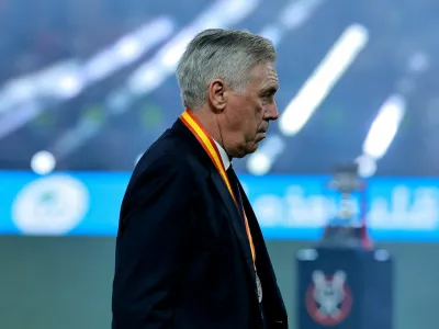 Soccer Football - Spanish Super Cup - Final - FC Barcelona v Real Madrid - King Abdullah Sports City, Jeddah, Saudi Arabia - January 12, 2025 Real Madrid coach Carlo Ancelotti looks dejected during the trophy presentation after losing the Spanish Super Cup final REUTERS/Stringer