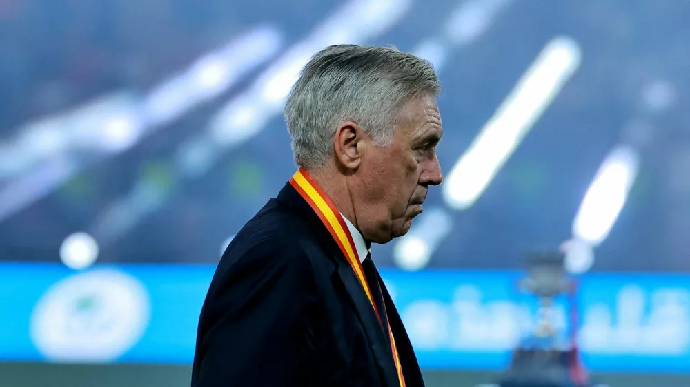 Soccer Football - Spanish Super Cup - Final - FC Barcelona v Real Madrid - King Abdullah Sports City, Jeddah, Saudi Arabia - January 12, 2025 Real Madrid coach Carlo Ancelotti looks dejected during the trophy presentation after losing the Spanish Super Cup final REUTERS/Stringer