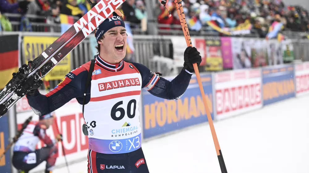 Vebjoern Soerum from Norway cheers at the finish after the men's individual 20km at the Biathlon World Cup in Ruhpolding, Germany, Wednesday Jan. 15, 2025. (Sven Hoppe/dpa via AP)