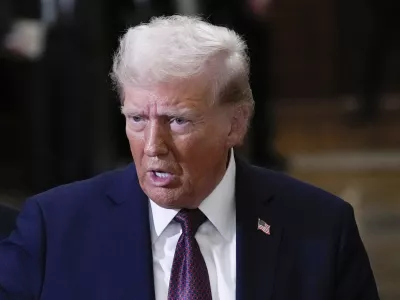 FILE - President-elect Donald Trump talks to reporters after a meeting with Republican leadership at the Capitol on Wednesday, Jan. 8, 2025, in Washington. (AP Photo/Steve Helber, File)