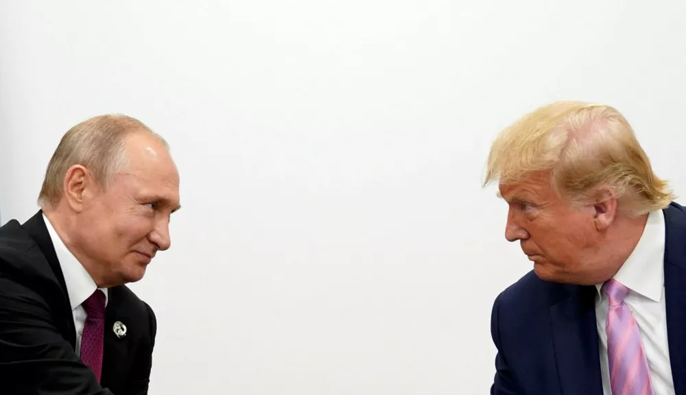 FILE PHOTO: U.S. President Donald Trump and Russian President Vladimir Putin hold a bilateral meeting at the G20 leaders summit in Osaka, Japan June 28, 2019. REUTERS/Kevin Lamarque/File Photo