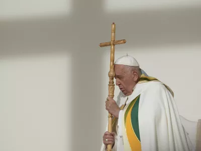 FILE - Pope Francis holds the pastoral staff as he presides over the Sunday mass at King Baudouin Stadium, in Brussels Sunday, Sept. 29, 2024. (AP Photo/Andrew Medichini)