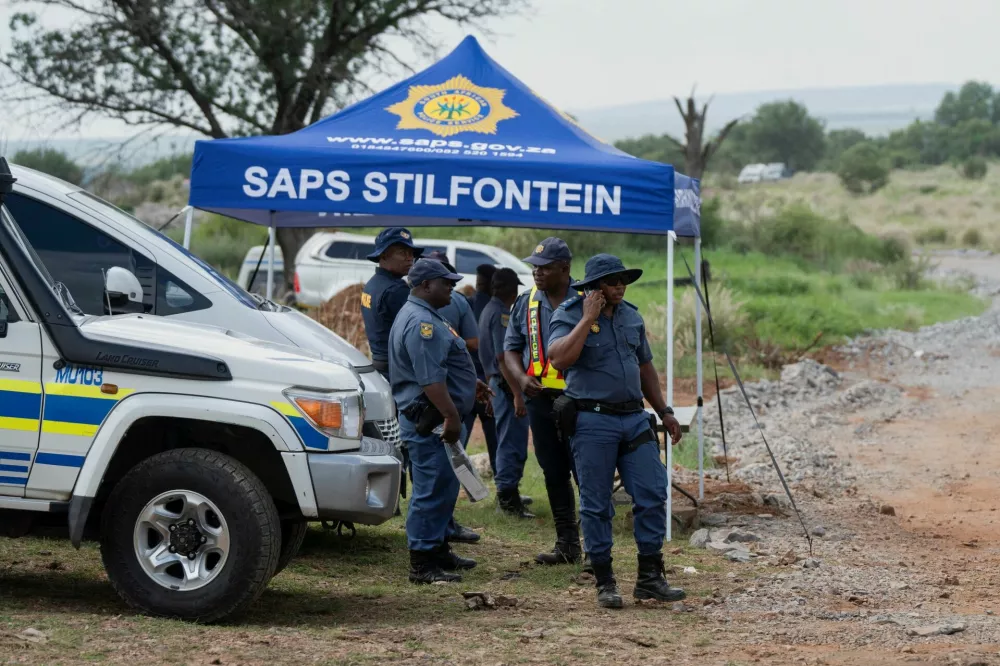 Members of the South African police, patrol as they guard the mine shaft where rescue operations are ongoing as attempts are made to rescue illegal miners who have been underground for months in Stilfontein, South Africa, January 14, 2025. REUTERS/Ihsaan Haffejee