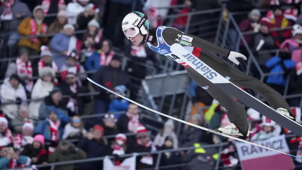 Anze Lanisek, of Slovenia, soars through the air during his trial jump at the Ski Jumping World Cup Men Large Hill Individual event in Zakopane, Poland, Sunday, Jan. 21, 2024. (AP Photo/Czarek Sokolowski)