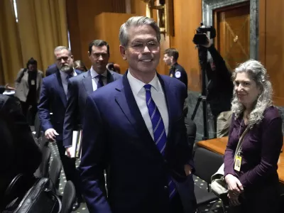 Scott Bessent, President-elect Donald Trump's choice to be Secretary of the Treasury, leaves after the Senate Finance Committee for his confirmation hearing, at the Capitol in Washington, Thursday, Jan. 16, 2025. (AP Photo/Ben Curtis)