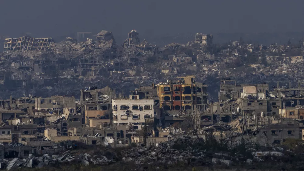 Destroyed buildings by Israeli bombardments as seen inside the Gaza Strip from southern Israel, Thursday, Jan. 16, 2025. (AP Photo/Ariel Schalit)