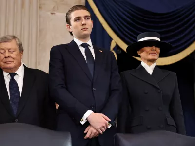 WASHINGTON, DC - JANUARY 20: (L-R) Viktor Knavs, Barron Trump and Melania Trump attend the inauguration of U.S. President-elect Donald Trump in the Rotunda of the U.S. Capitol on January 20, 2025 in Washington, DC. Donald Trump takes office for his second term as the 47th president of the United States.  Chip Somodevilla/Pool via REUTERS