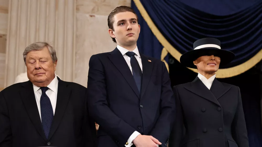 WASHINGTON, DC - JANUARY 20: (L-R) Viktor Knavs, Barron Trump and Melania Trump attend the inauguration of U.S. President-elect Donald Trump in the Rotunda of the U.S. Capitol on January 20, 2025 in Washington, DC. Donald Trump takes office for his second term as the 47th president of the United States.  Chip Somodevilla/Pool via REUTERS