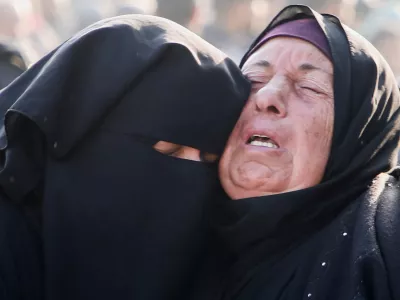 Mourners react near the bodies of Palestinians killed in Israeli airstrikes, amid the Israel-Hamas conflict, at Nasser hospital in Khan Younis, southern Gaza Strip, January 17, 2025. REUTERS/Hatem Khaled