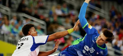 Handball - IHF Handball World Championships 2025 - Preliminary Round - Group G - Slovenia v Cuba - Zagreb Arena, Zagreb, Croatia - January 16, 2025 Slovenia's Domen Makuc in action with Cuba's Claudio Madrigal REUTERS/Antonio Bronic